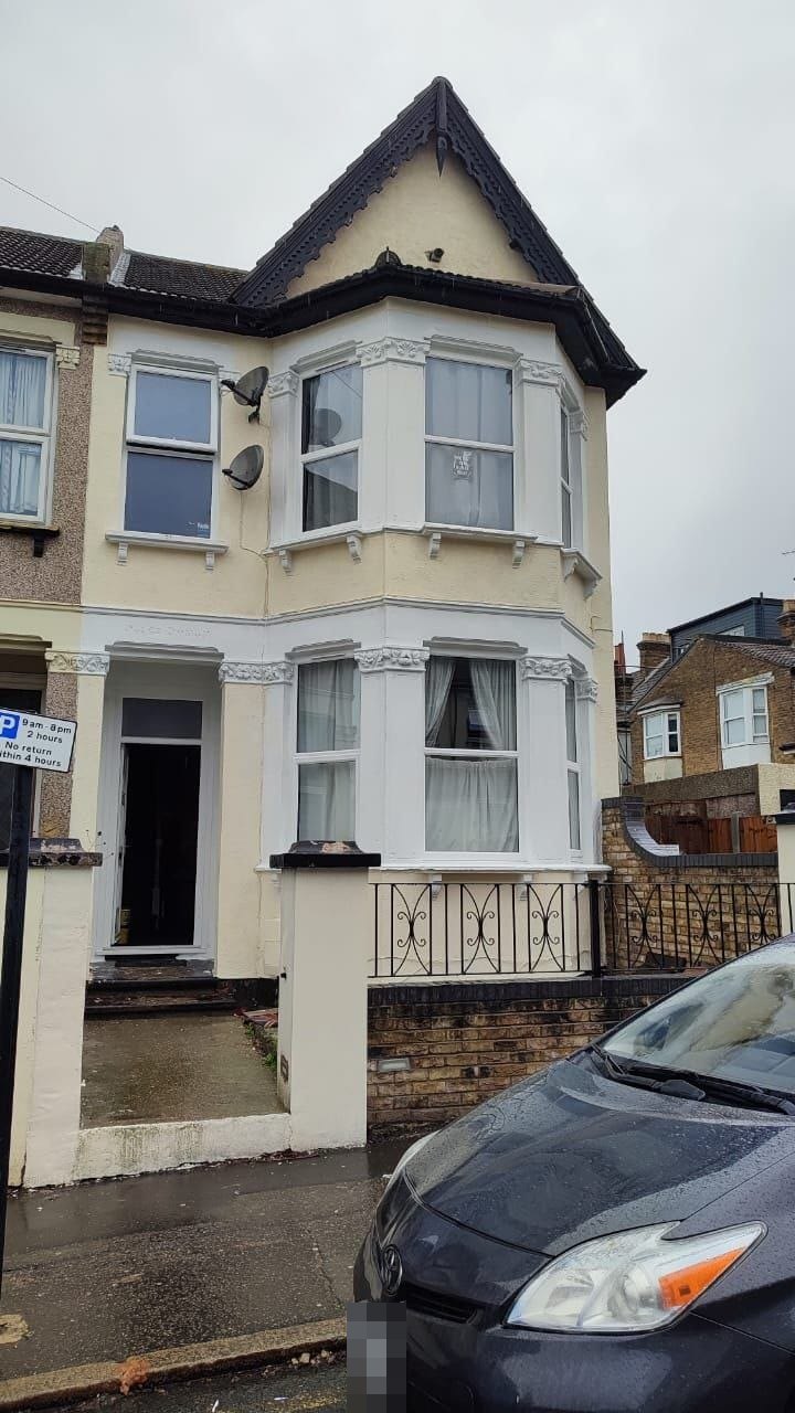 End-of-terrace house after exterior refurbishment, freshly painted